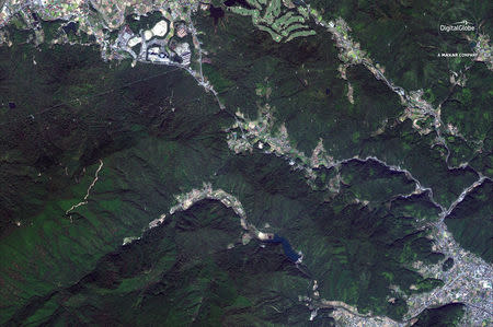 A satellite image of "before the floods" northwest of Yasuura, Japan, captured October 26, 2017. Satellite image 2018 DigitalGlobe, a Maxar company/Handout via REUTERS