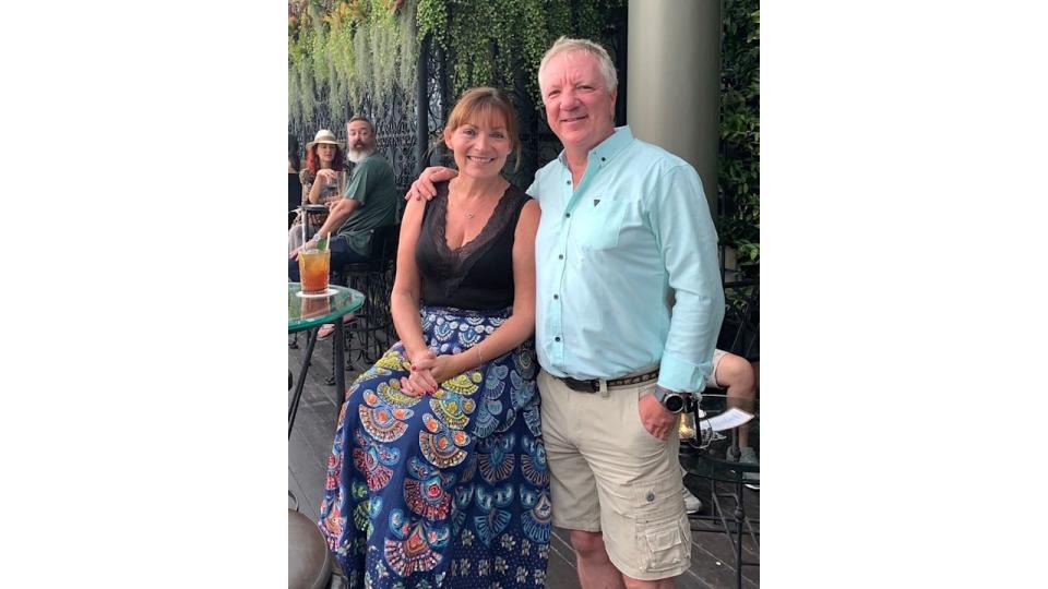 couple posing for photo in outdoor bar 