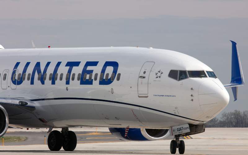 united airlines plane on runway - listed as one of the best airlines for vegan meals