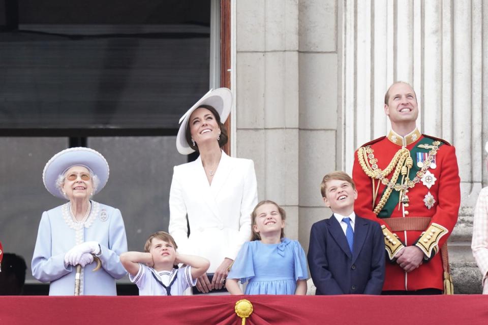 Royal move to Windsor: Queen Elizabeth II, Prince Louis, the Duchess of Cambridge, Princess Charlotte, Prince George, and the Duke of Cambridge, on the balcony of Buckingham Palace, to view the Platinum Jubilee flypast. (PA)