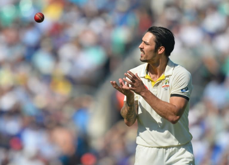 Australia's Mitchell Johnson catches the ball as Australia enforce a follow-on on the third day of the fifth Ashes cricket Test match between England and Australia at the Oval in London on August 22, 2015. AFP PHOTO / GLYN KIRK RESTRICTED TO EDITORIAL USE. NO ASSOCIATION WITH DIRECT COMPETITOR OF SPONSOR, PARTNER, OR SUPPLIER OF THE ECB