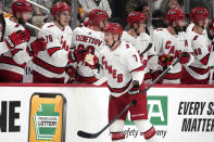 Carolina Hurricanes' Dmitry Orlov (7) returns to the bench after scoring against the Pittsburgh Penguins during the second period of an NHL hockey game in Pittsburgh, Tuesday, March 26, 2024. (AP Photo/Gene J. Puskar)
