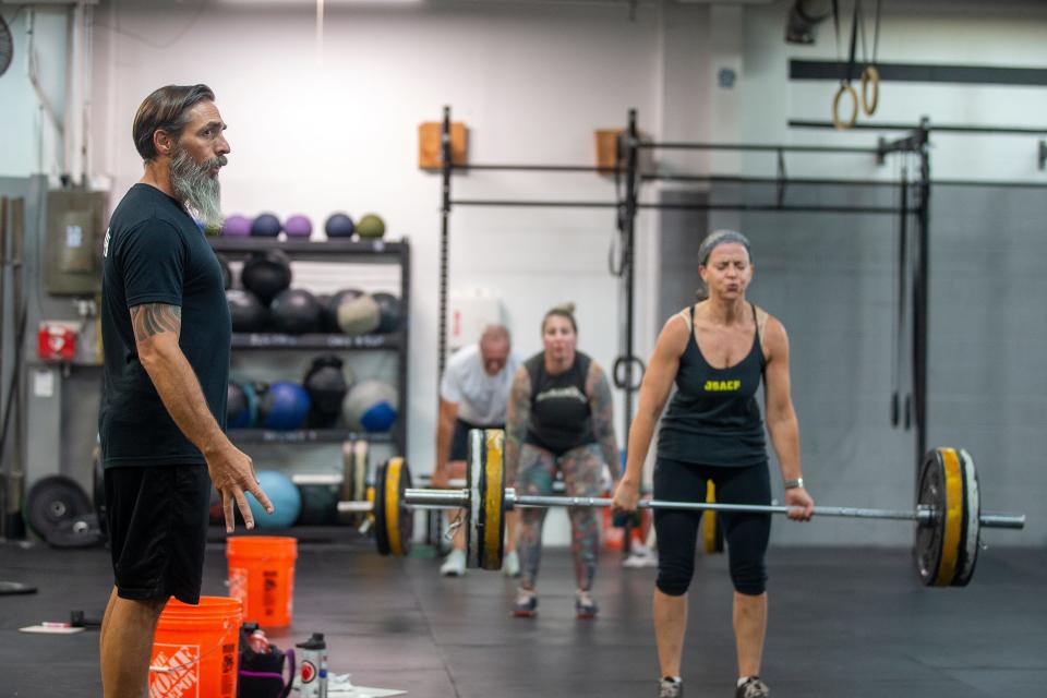 Skip Chapman, owner of JSA CrossFit, coaches a workout of the day class at JSA CrossFit in Manasquan, NJ Thursday, September 8, 2022.