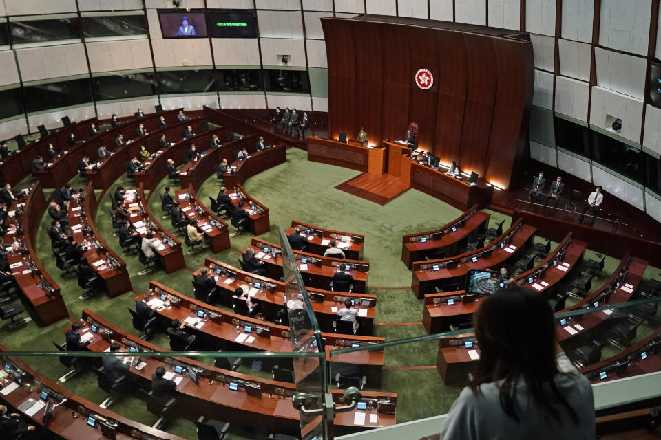 Hong Kong Chief Executive Carrie Lam delivers her policies at chamber of the Legislative Council in Hong Kong, Wednesday, Nov. 25, 2020. Lam said Wednesday that the city's new national security law has been “remarkably effective in restoring stability” after months of political unrest, and that bringing normalcy back to the political system is an urgent priority. (AP Photo/Kin Cheung)