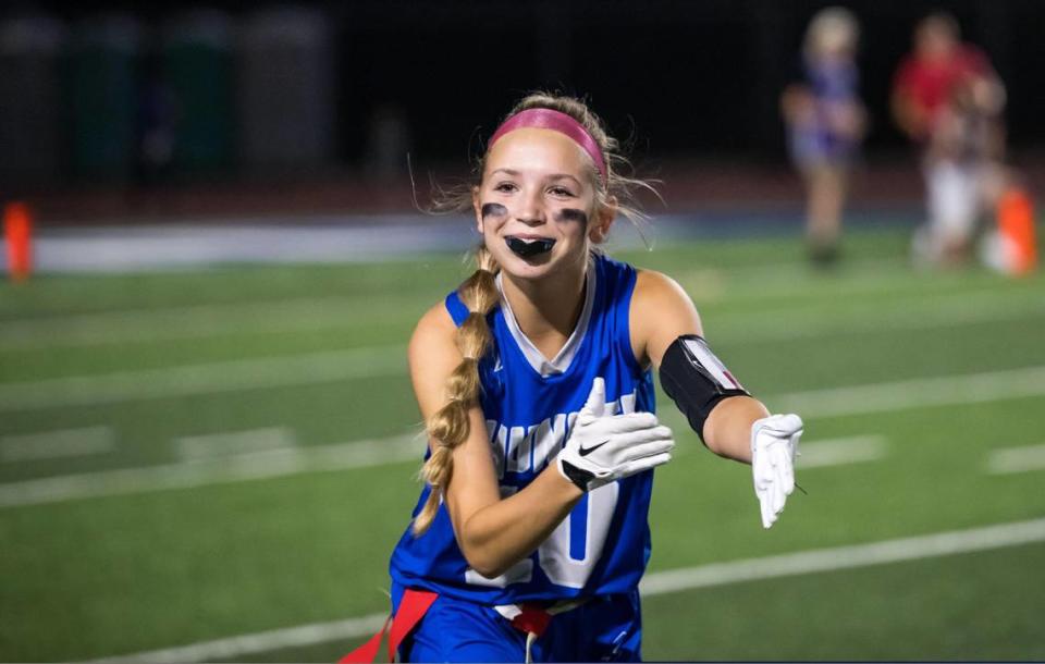 Rocklin Thunder defensive back Abigail Schrader (10) celebrates breaking up a Whitney Wildcats pass during the second half of the high school girls flag football game Thursday, Sept. 28, 2023, at Rocklin High School.
