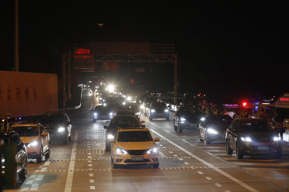 WUHAN, April 8, 2020 .Cars prepare to pass an expressway toll station in western Wuhan, central China's Hubei Province, April 8, 2020. Wuhan, the megacity in central China, started lifting outbound travel restrictions from Wednesday after almost 11 weeks of lockdown to stem the spread of COVID-19. (Photo by Shen Bohan/Xinhua via Getty) (Xinhua/Shen Bohan via Getty Images)