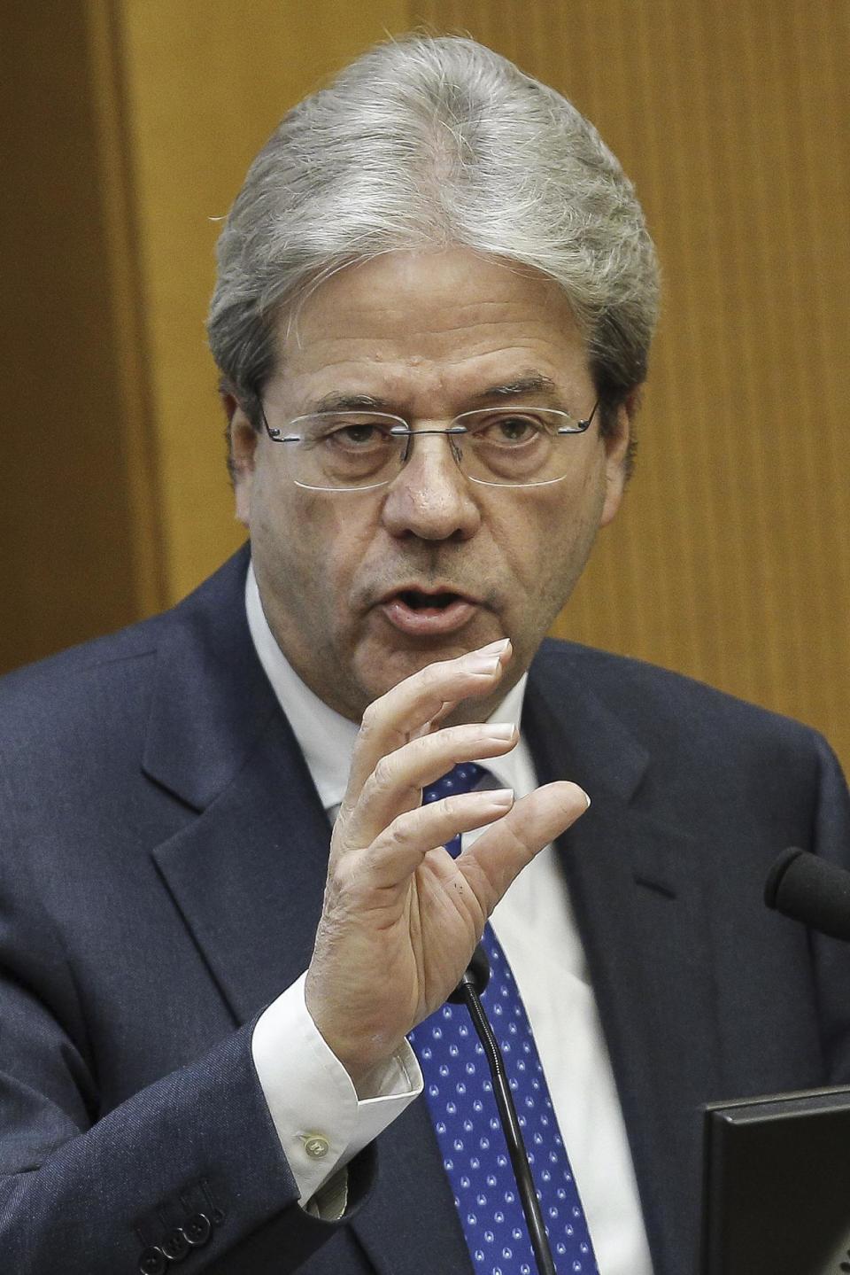 Italian Premier Paolo Gentiloni answers to journalists' questions as he holds a year-end press conference, in Rome, Thursday Dec. 29, 2016. Gentiloni said the government will take further measures to combat terrorism following the shooting death of a Tunisian fugitive near Milan, including speedier repatriation of illegal migrants. (Giuseppe Lami/ANSA via AP)