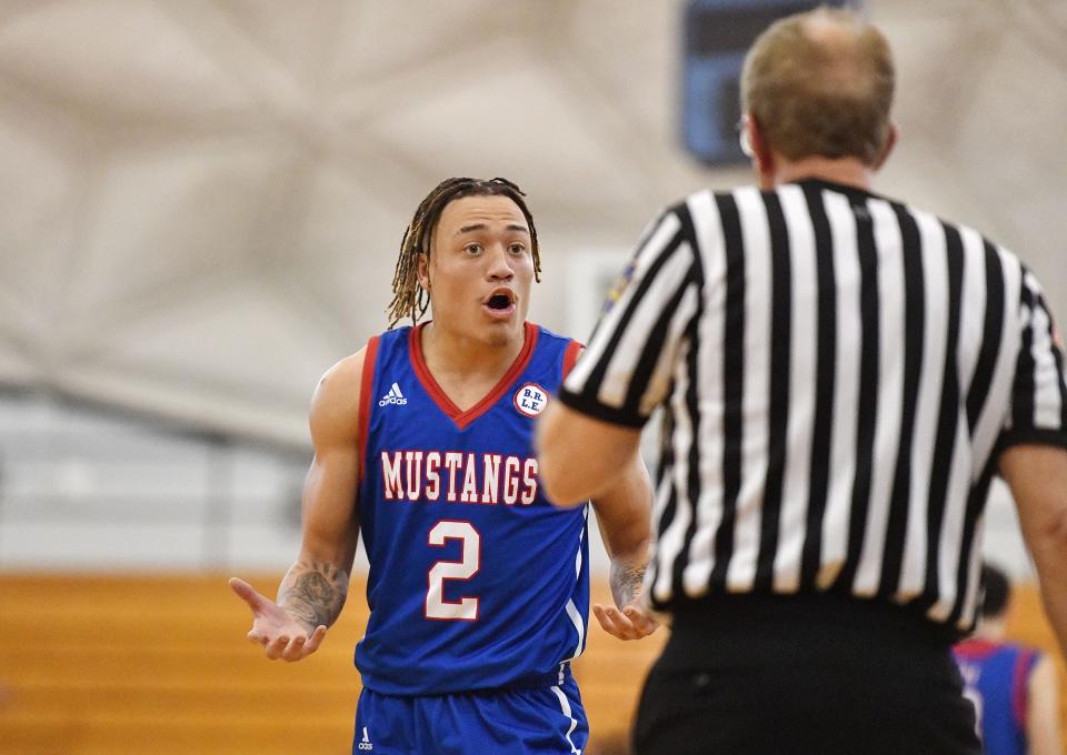 Laurel Highlands' Rodney Gallagher reacts to an official's call during the Central Valley Roundball Classic Thursday at the Community College of Beaver County Dome.