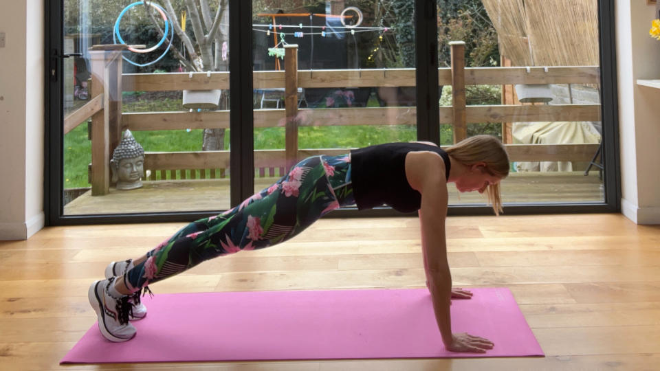 Maddy Biddulph performing holding a plank position