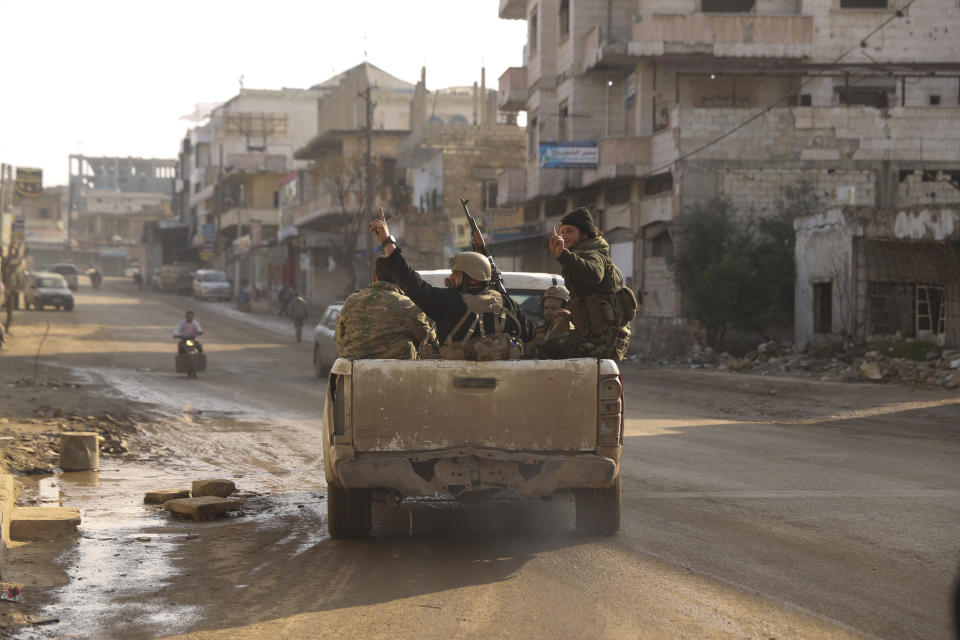 Syrian rebel drive toward the government positions near the village of Nerab, in Idlib province, Thursday, Feb. 6, 2020. Turkey sent more reinforcements into northwestern Syria on Thursday, setting up new positions in an attempt to stop a Syrian government offensive on the last rebel stronghold in the war-torn country, state media and opposition activists said. (AP Photo/Ghaith Alsayed)