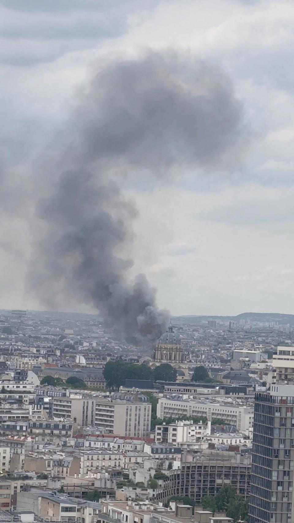 Smoke from the explosion curled up into the sky over the landmarks of Paris (via REUTERS)