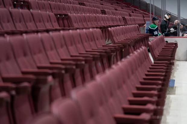 Jake Virtanen sits in the penalty box on Feb. 25, 2021. Vancouver police say they have opened an investigation after allegations of sexual misconduct involving the Vancouver Canucks forward surfaced in the media. (Jonathan Hayward/The Canadian Press - image credit)