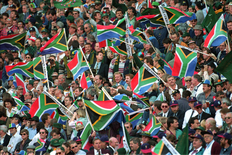 File - In this file Saturday, June 24, 1995 file photo a sea of South African flags fill the stands at the Ellis Park stadium at the Rugby World Cup Rugby final in Johannesburg. Parkin, who covered the country's anti-apartheid struggle, its first democratic elections, and the presidency of Nelson Mandela, has died Monday Aug. 23, 2021, at the age of 63 according to his daughter. (AP Photo/John Parkin, file)