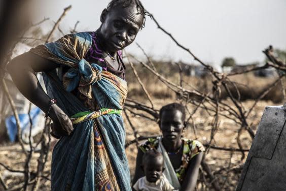 Women at a water hole in South Sudan (Bel Trew)