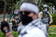 Police officers stand guard during in a protest outside the Federal Building against Israel and in support of Palestinians, Saturday, May 15, 2021 in the Westwood section of Los Angeles. (AP Photo/Ringo H.W. Chiu)