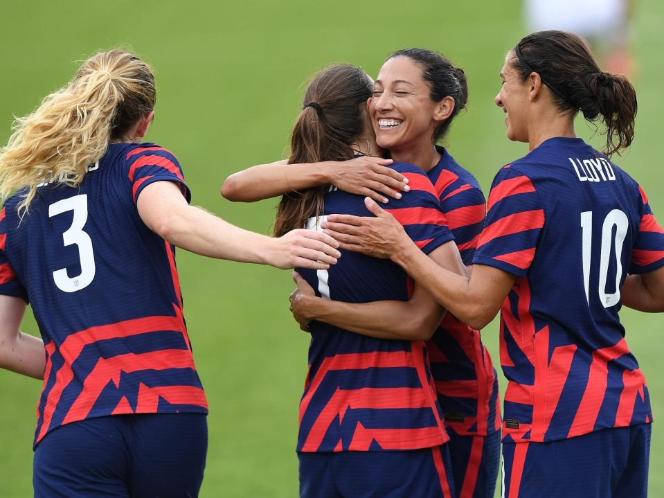 Christen Press celebrates with her USWNT teammates.