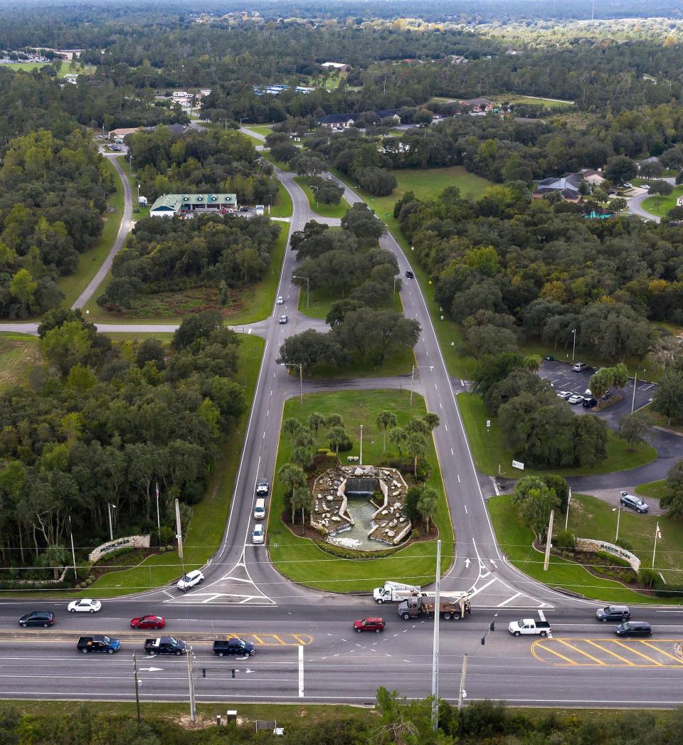 Looking south on Marion Oak Boulevard, traffic makes its way east and west on County Road 484 in 2019.