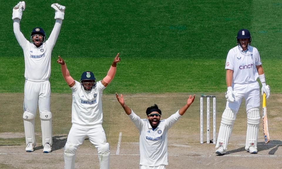 <span>India’s Ravindra Jadeja (centre) leads the appeals that led to Joe Root’s dismissal after the England batter failed to pick up a straightening delivery.</span><span>Photograph: Adnan Abidi/Reuters</span>