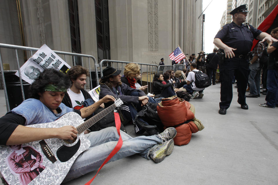 In this Sept. 17, 2011 file photo, demonstrators affiliated with the Occupy Wall Street movement gather to call for the occupation of Wall Street in New York. Monday, Oct. 17, 2012 marks the one-year anniversary of the Occupy Wall Street movement. (AP Photo/Frank Franklin II, File)