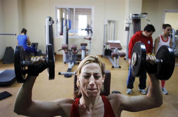 Spanish boxer Jennifer Miranda lifts weights during a training session at a high-performance sports centre in Los Alcazares, southeastern Spain, April 3, 2012.