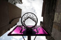 The basketball court Pigalle Duperre, painted in shades of purple, pink, yellow, orange and blue, and with a rubber-surfaced court, is sandwiched into a row of buildings in the 9th arrondissement, is pictured in Paris, France, July 31, 2018. REUTERS/Benoit Tessier