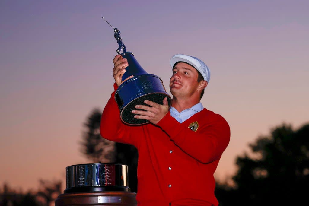 Bryson DeChambeau celebrates with the trophy after winning the 2021 Arnold Palmer Invitational (Getty)