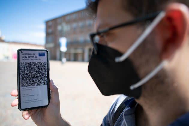 TURIN, ITALY - JUNE 30: A man shows Italy's Covid-19 Green Pass for post-vaccine travel on a smartphone on June 30, 2021 in Turin, Italy. The digital health certificate, or Green Pass, was officially launched by Italian Prime Minister Draghi, allowing people to access certain events and facilities in Italy as well as travel domestically and abroad. (Photo by Stefano Guidi/Getty Images) (Photo: Stefano Guidi via Getty Images)