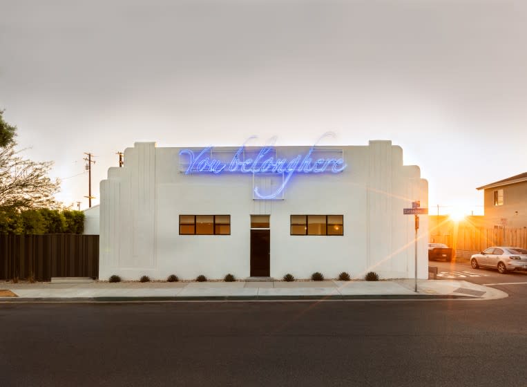 Tavares Strachan's "You Belong Here (Blue #1)," on the facade of Compound.