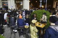People gather and celebrate as bars, clubs and other establishments reopened in Poland after being closed for seven months, in Warsaw, Poland, Friday, May 14, 2021. (AP Photo/Czarek Sokolowski)