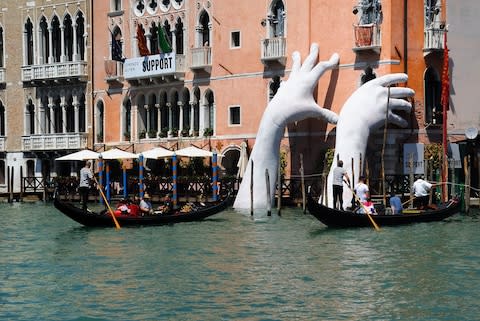 Lorenzo Quinn's installation on the Grand Canal at the Venice Biennale last year - Credit: Credit: Ferdinando Piezzi / Alamy Stock Photo/Ferdinando Piezzi / Alamy Stock Photo