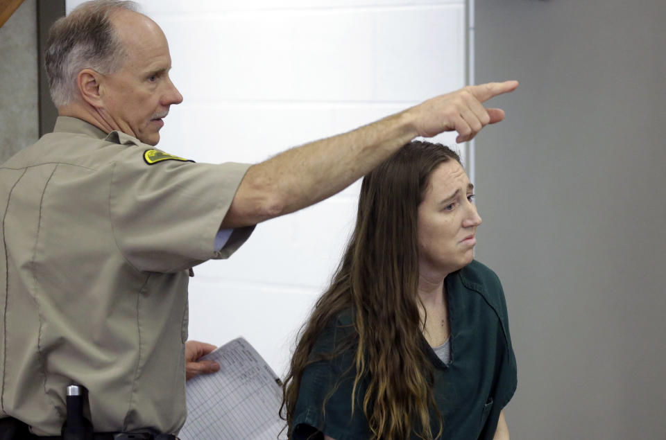 Megan Huntsman, accused of killing six of her babies and storing their bodies in her garage, appears in court Monday, April 21, 2014, in Provo, Utah. A state judge granted county prosecutors a week to sort through evidence and ensure they choose the proper charges. Huntsman is being held on $6 million bail. (AP Photo/Rick Bowmer, Pool)