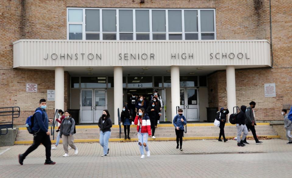 Students at Johnston High School leave the building, dismissed early on Monday because 23 teachers called in sick and there weren't enough substitutes to cover.