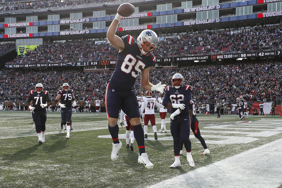 New England Patriots tight end Hunter Henry (85) spikes the ball as he celebrates his touchdown in the first half of an NFL football game against the Washington Commanders, Sunday, Nov. 5, 2023, in Foxborough, Mass. (AP Photo/Michael Dwyer)