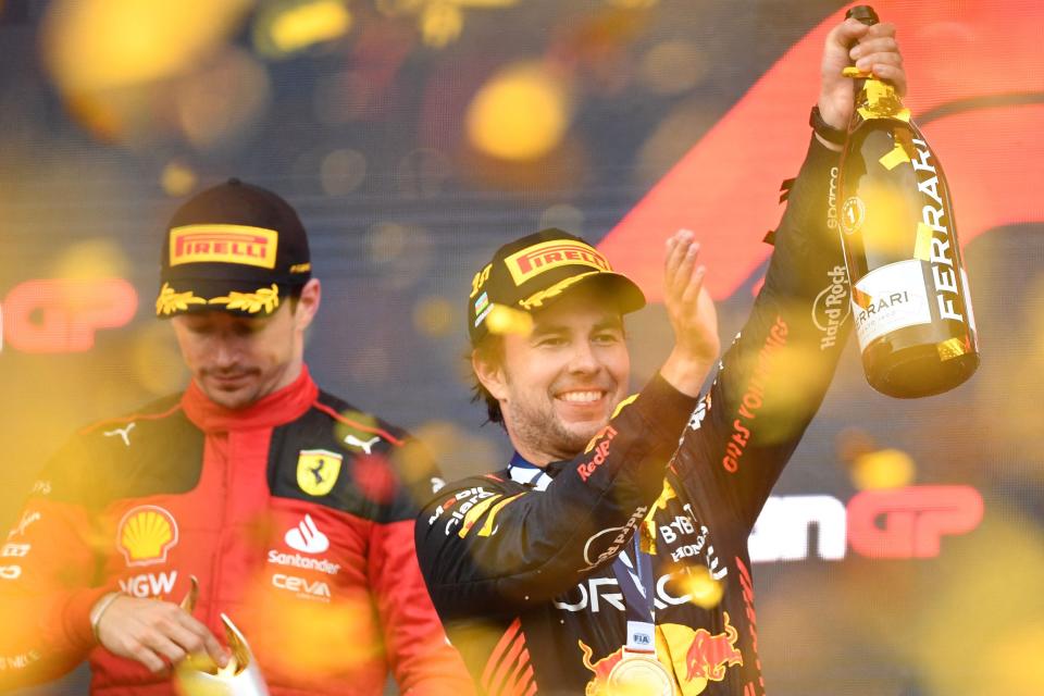 Red Bull Racing's Sergio Perez celebrates his Azerbaijan Grand Prix victory on the podium.