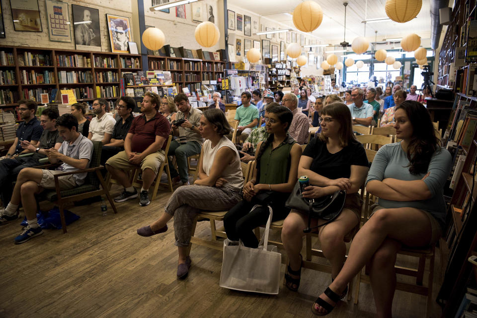 The audience&nbsp;listens&nbsp;as journalist Curtis Wilkie speaks with Mayor Robyn Tannehill.