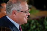 Australian Prime Minister Scott Morrison reacts after attending the inauguration of Indonesia's President Joko Widodo for the second term, at the House of Representatives building in Jakarta