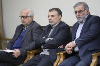 In this picture released by the official website of the office of the Iranian supreme leader, Mohsen Fakhrizadeh, right, sits in a meeting with Supreme Leader Ayatollah Ali Khamenei in Tehran, Iran, Jan. 23, 2019. Fakhrizadeh, an Iranian scientist that Israel alleged led the Islamic Republic's military nuclear program until its disbanding in the early 2000s was killed in a targeted attack that saw gunmen use explosives and machine gun fire Friday Nov. 27, 2020, state television said. Two others are unidentified. (Office of the Iranian Supreme Leader via AP)