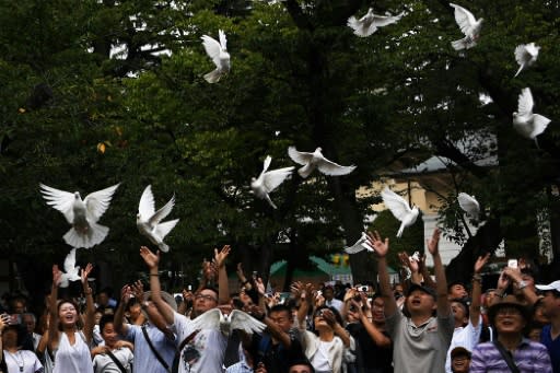 Doves are released as a symbol of peace at the Yasukuni shrine in Tokyo on the 74th anniversary of Japan's surrender in World War II