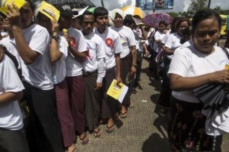 Members and supporters of Ma Ba Tha line up at the entrance to attend a celebration of the recent establishment of four controversial bills decried by rights groups as aimed at discriminating against the country's Muslim minority, at a rally in a stadium at Yangon October 4, 2015. REUTERS/Soe Zeya Tun