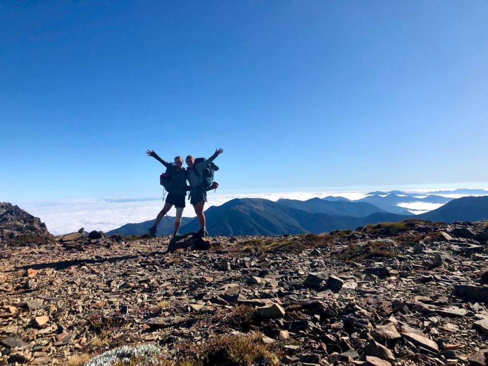 Claire Lewinski, right, and Ashley Ludack pose for a photo on the ridges of New Zealand’s Richmond Ranges while thru-hiking the Te Araroa trail.