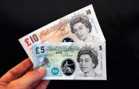 A sample Polymer five and ten pound banknote are shown during the news conference at the Bank of England in London during a consultation on plans to issue plastic bank notes within the next three years.
