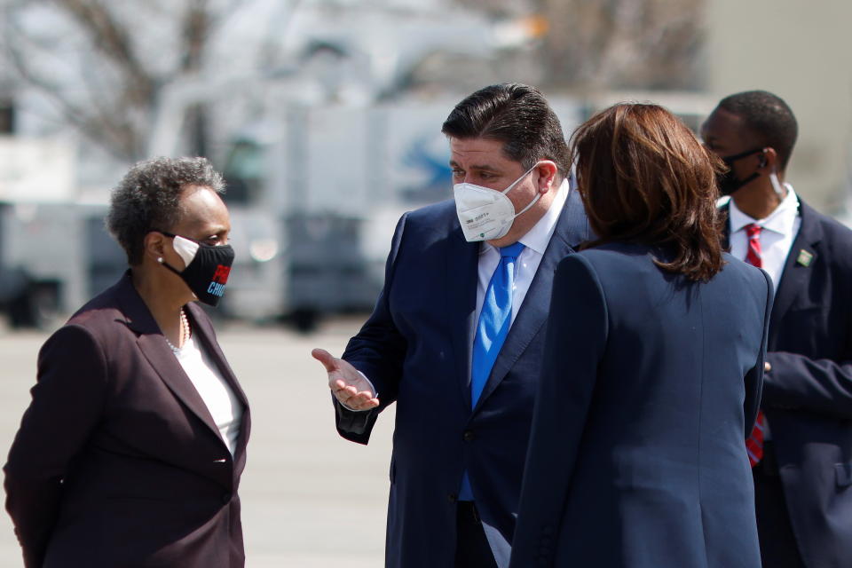 U.S. Vice President Kamala Harris meet Illinois' Governor J.B. Pritzker and Chicago's Mayor Lori Lightfoot after arriving at Chicago Midway International Airport in Chicago, Illinois, U.S., April 6, 2021. REUTERS/Carlos Barria