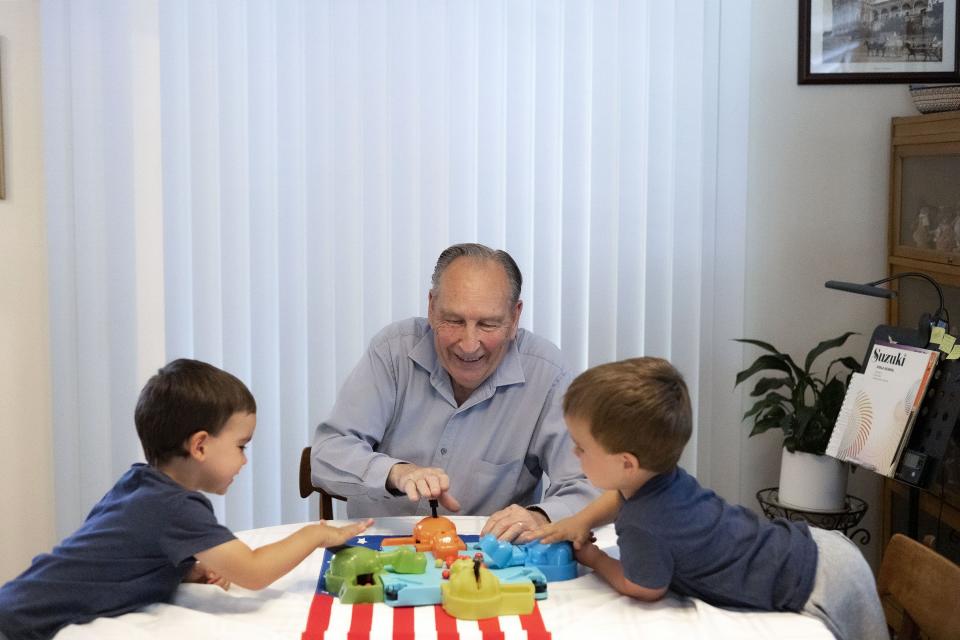 Ren Willie plays with his grandsons, Oliver and Tate, at his Murray home on Wednesday, July 5, 2023. A year ago, Willie was diagnosed with Alzheimer’s dementia, a progressive neurodegenerative disease that destroys memory and other mental functions over time. | Laura Seitz, Deseret News