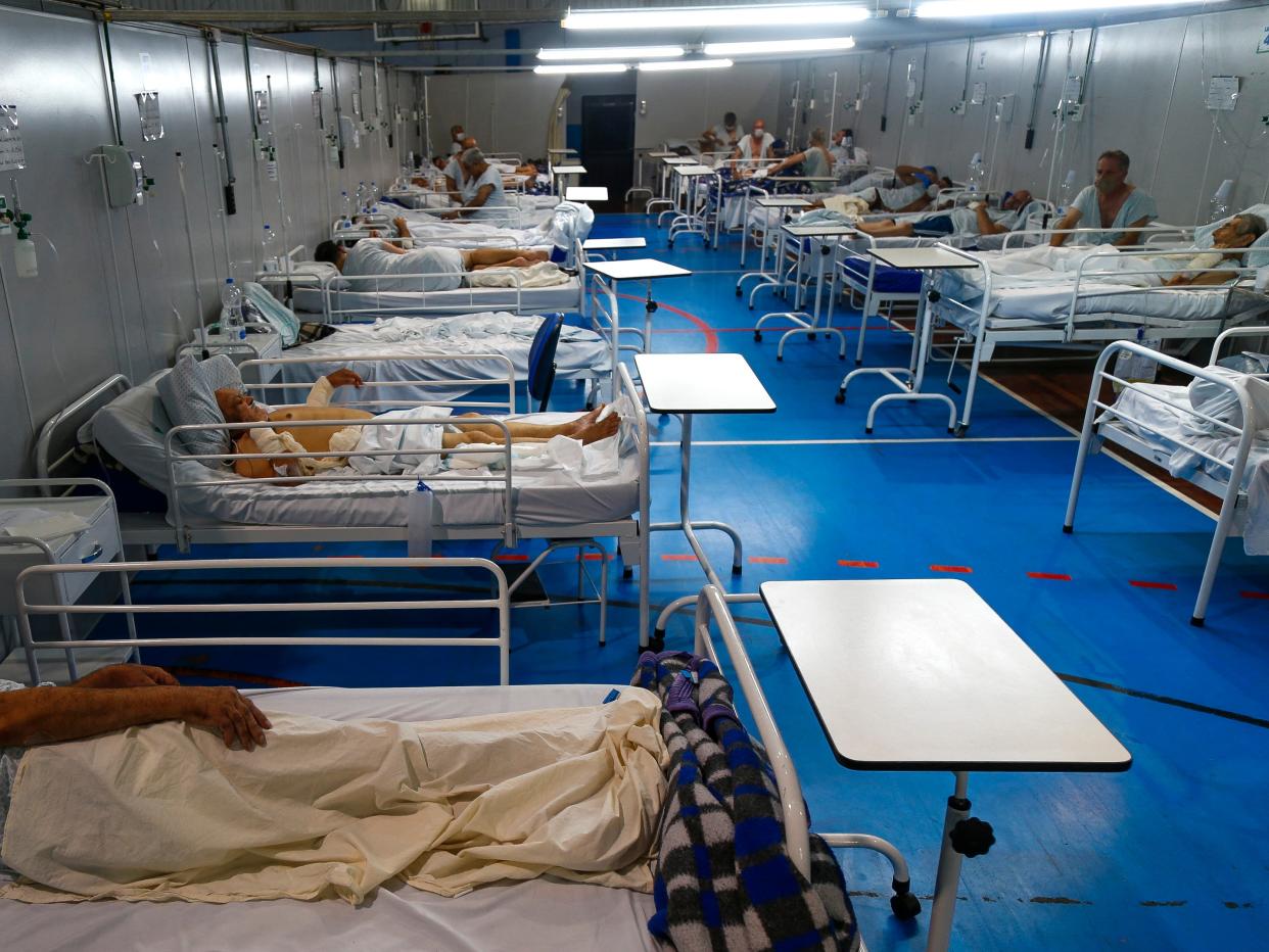 Covid patients are treated at a field hospital set up at a sports gym, in Santo Andre, Sao Paulo state, Brazil, in March (AFP via Getty Images)