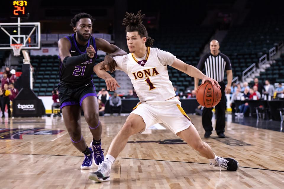 Iona guard Walter Clayton Jr. (1) tries to get past Niagara guard Noah Thomasson (21) during the first half at Jim Whelan Boardwalk Hall on March 10, 2023 in Atlantic City, N.J.