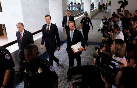 White House Senior Adviser Jared Kushner (C) and his attorney Abe Lowell (R) depart following Kushner's appearance before a closed session of the Senate Intelligence Committee as part of their probe into Russian meddling in the 2016 U.S. presidential election, on Capitol Hill in Washington, U.S. July 24, 2017. REUTERS/Jonathan Ernst