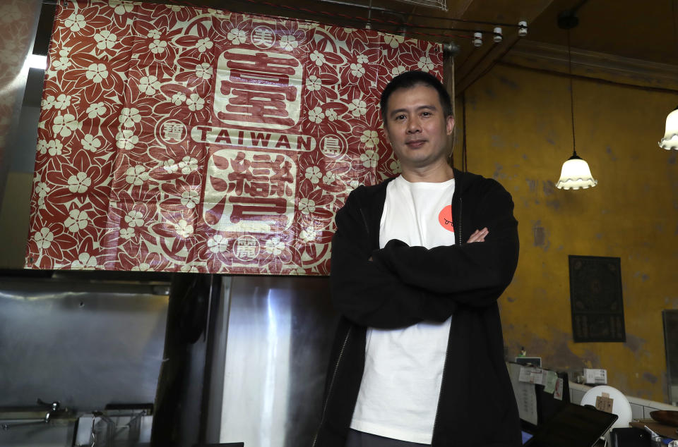 Restaurateur Andy Huang speaks during an interview at his restaurant in Taipei, Taiwan, on May 7, 2023. Huang said he's become desensitized to military threats from China. Taiwan’s government is racing to counter China’s military, but many on the island say they don’t share the sense of threat. (AP Photo/Chiang Ying-ying)