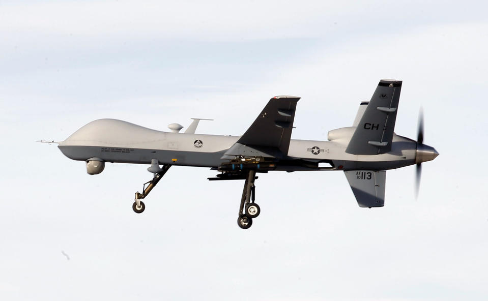 A MQ-9 Reaper drone flies by during a training mission at Creech Air Force Base on November 17, 2015, in Indian Springs, Nevada. / Credit: Isaac Brekken/Getty Images