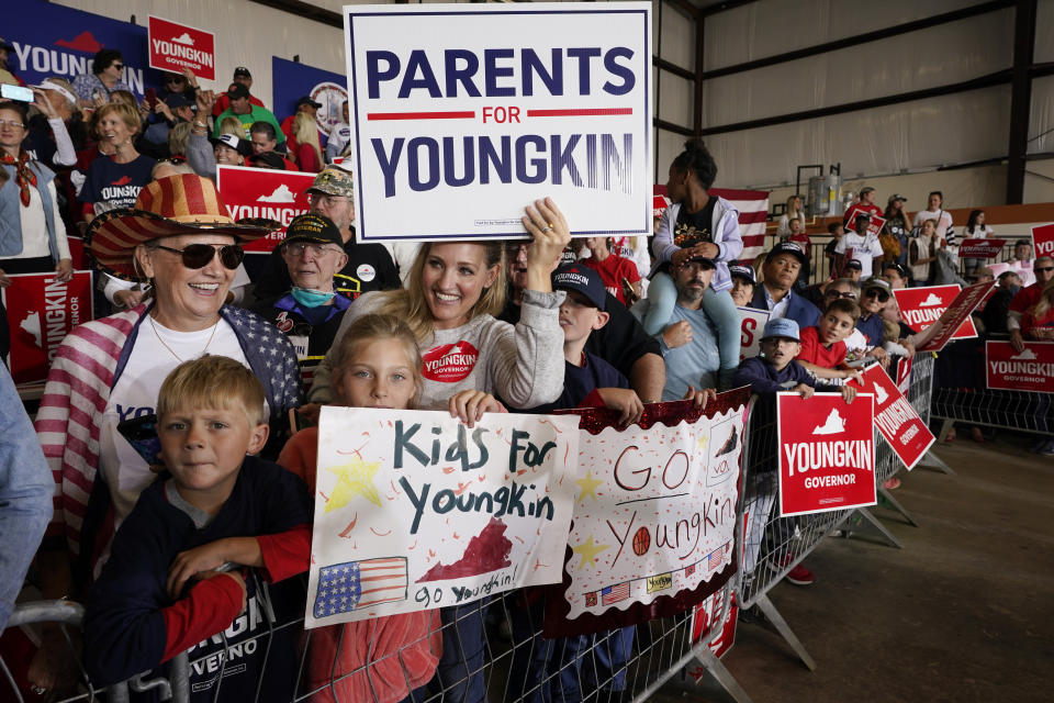 Supporters of Republican gubernatorial candidate Glenn Youngkin cheer on their candidate during a rally in Chesterfield, Va., Monday, Nov. 1, 2021. Youngkin will face Democrat former Gov. Terry McAuliffe in the November election. (AP Photo/Steve Helber)