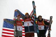 Freestyle Skiing - Pyeongchang 2018 Winter Olympics - Men's Ski Halfpipe Finals - Phoenix Snow Park - Pyeongchang, South Korea - February 22, 2018 - Gold medallist David Wise of the U.S. flanked by silver medallist Alex Ferreira of the U.S. and bronze medallist Nico Porteous of New Zealand celebrate during the flower ceremony. REUTERS/Issei Kato